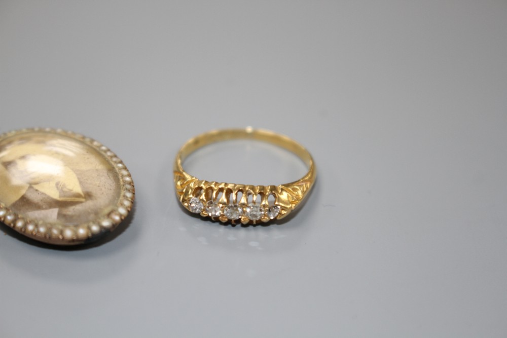 A George V 18ct gold and graduated five stone diamond ring and a 19ct century locket(a.f.).